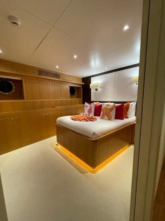 a bed in a room aboard THE BIG BLUE Yacht for Sale