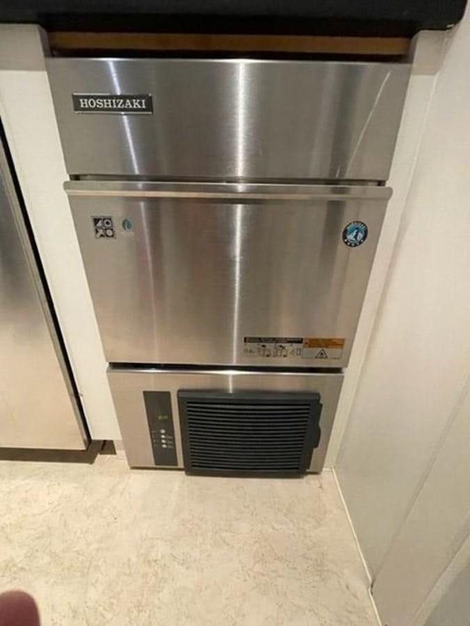 a silver and black refrigerator aboard THE BIG BLUE Yacht for Sale
