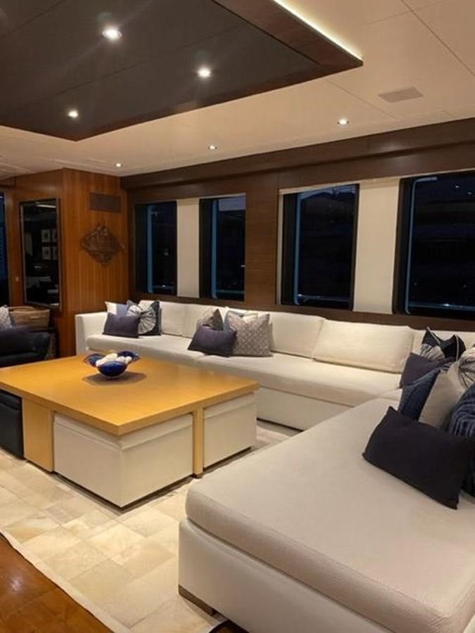 a living room with a couch and a table aboard THE BIG BLUE Yacht for Sale