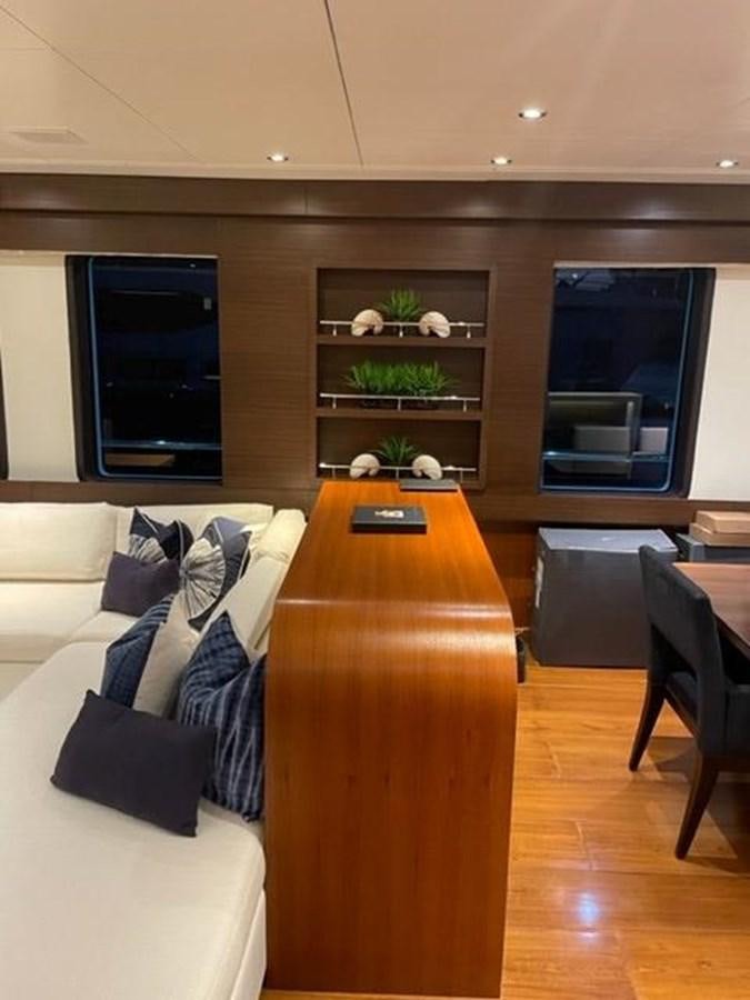 a living room with a couch and a tv aboard THE BIG BLUE Yacht for Sale