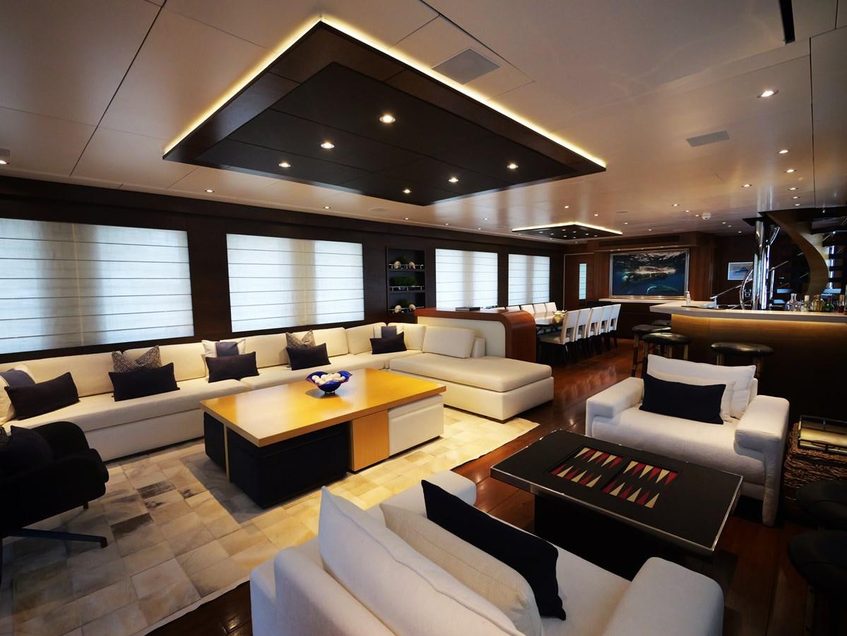a living room with a large ceiling aboard THE BIG BLUE Yacht for Sale