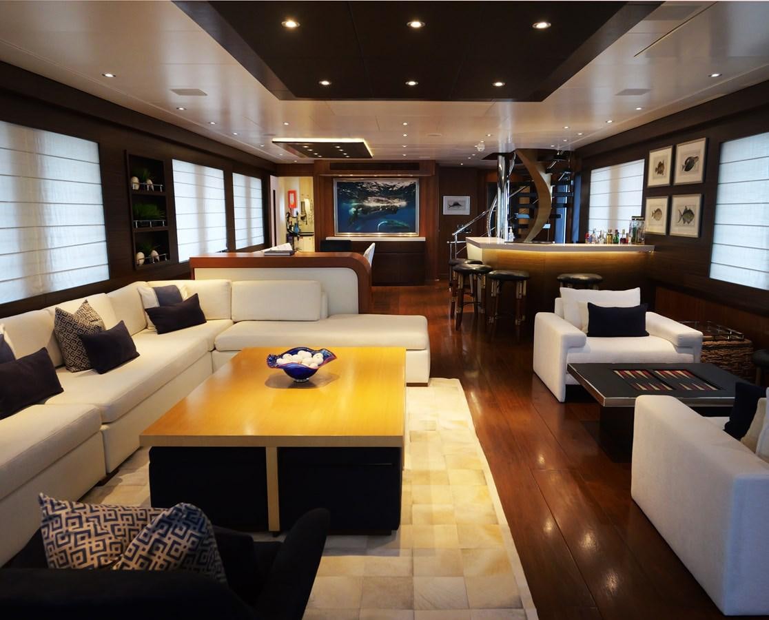a living room with a large window aboard THE BIG BLUE Yacht for Sale