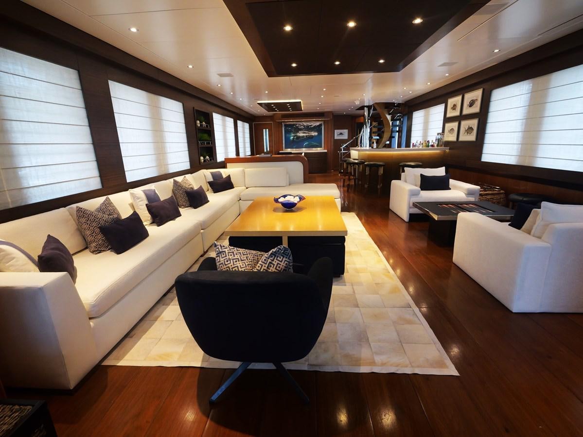 a living room with a couch and a table aboard THE BIG BLUE Yacht for Sale