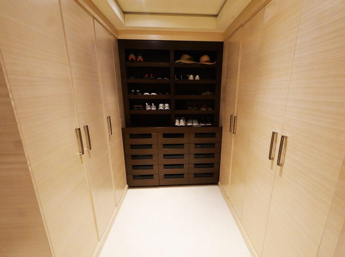 a room with a cabinet and shelves aboard THE BIG BLUE Yacht for Sale