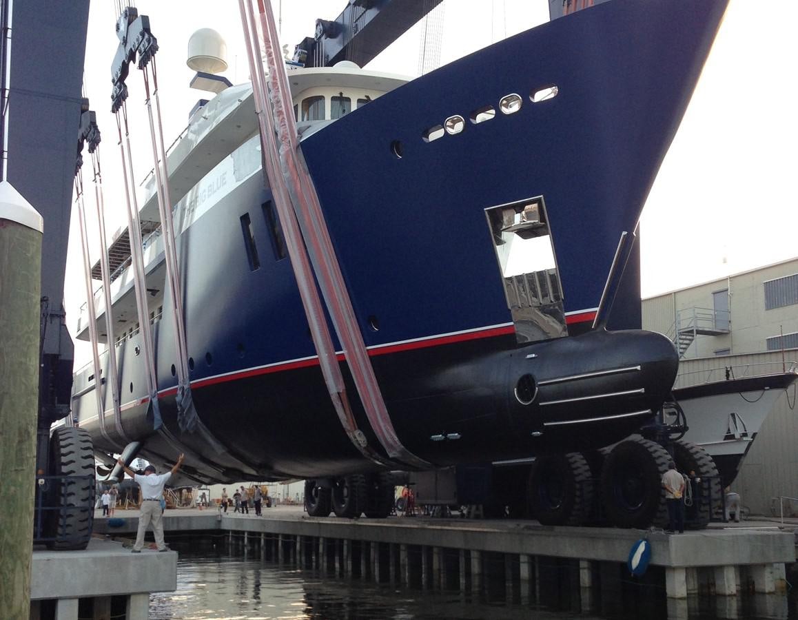 a large blue and red airplane aboard THE BIG BLUE Yacht for Sale