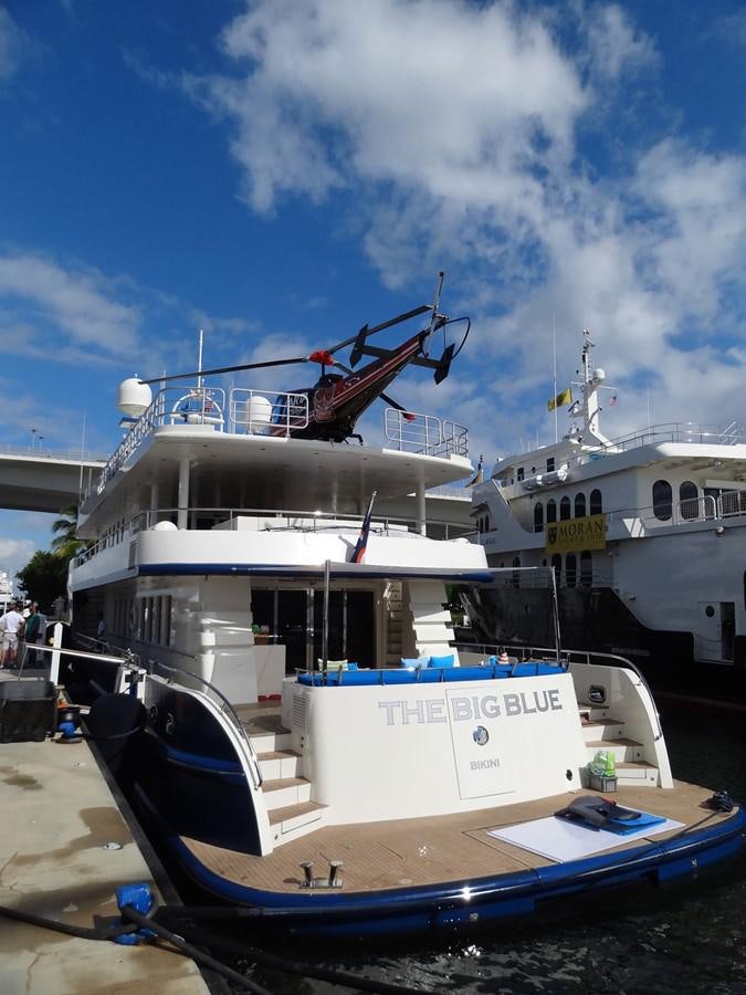 a boat with a crane on the deck aboard THE BIG BLUE Yacht for Sale