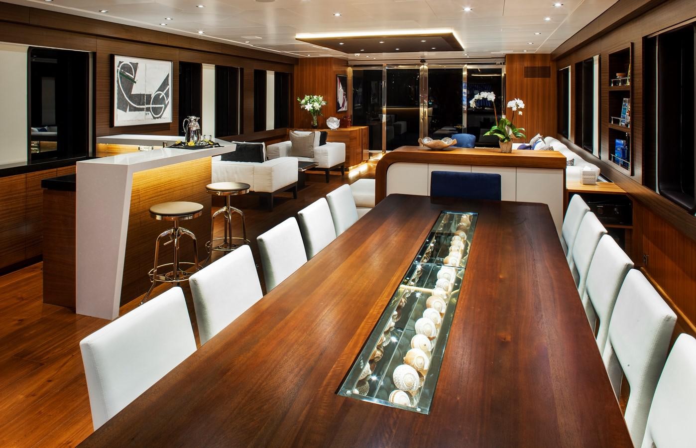a room with a pool table and chairs aboard THE BIG BLUE Yacht for Sale