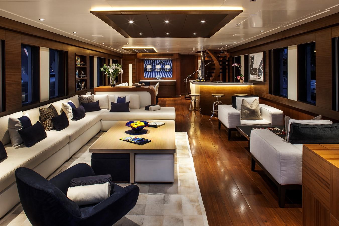 a living room with a couch and a coffee table aboard THE BIG BLUE Yacht for Sale