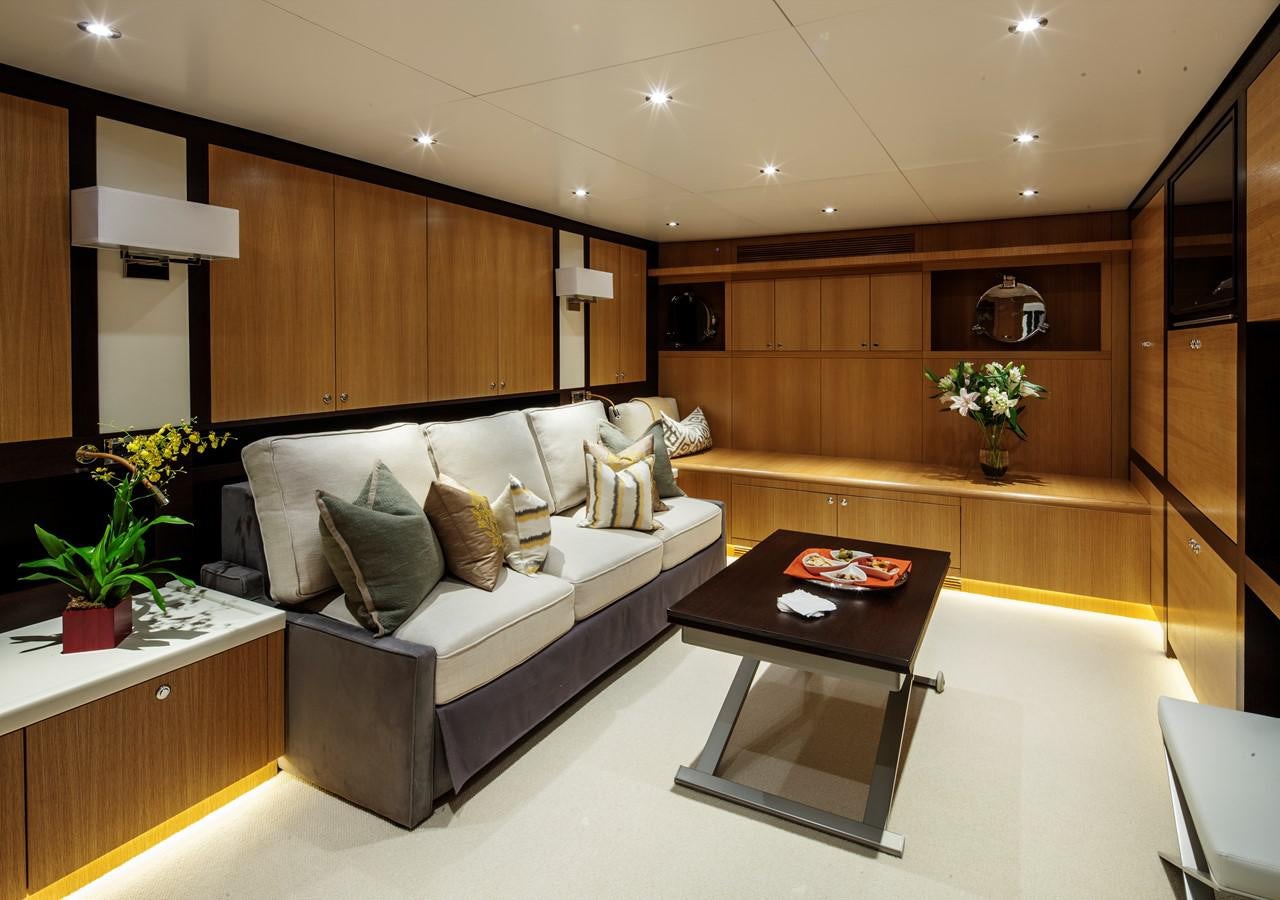 a living room with a couch and coffee table aboard THE BIG BLUE Yacht for Sale