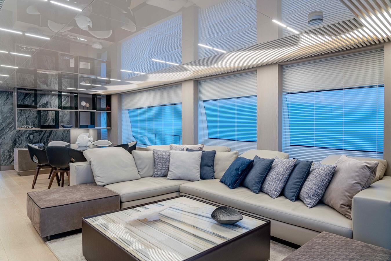 a living room with a couch and a table aboard YEMAJA Yacht for Sale