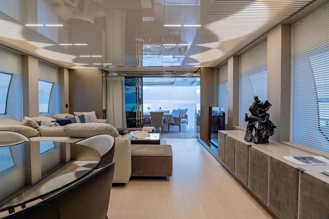 a living room with a large window aboard YEMAJA Yacht for Sale