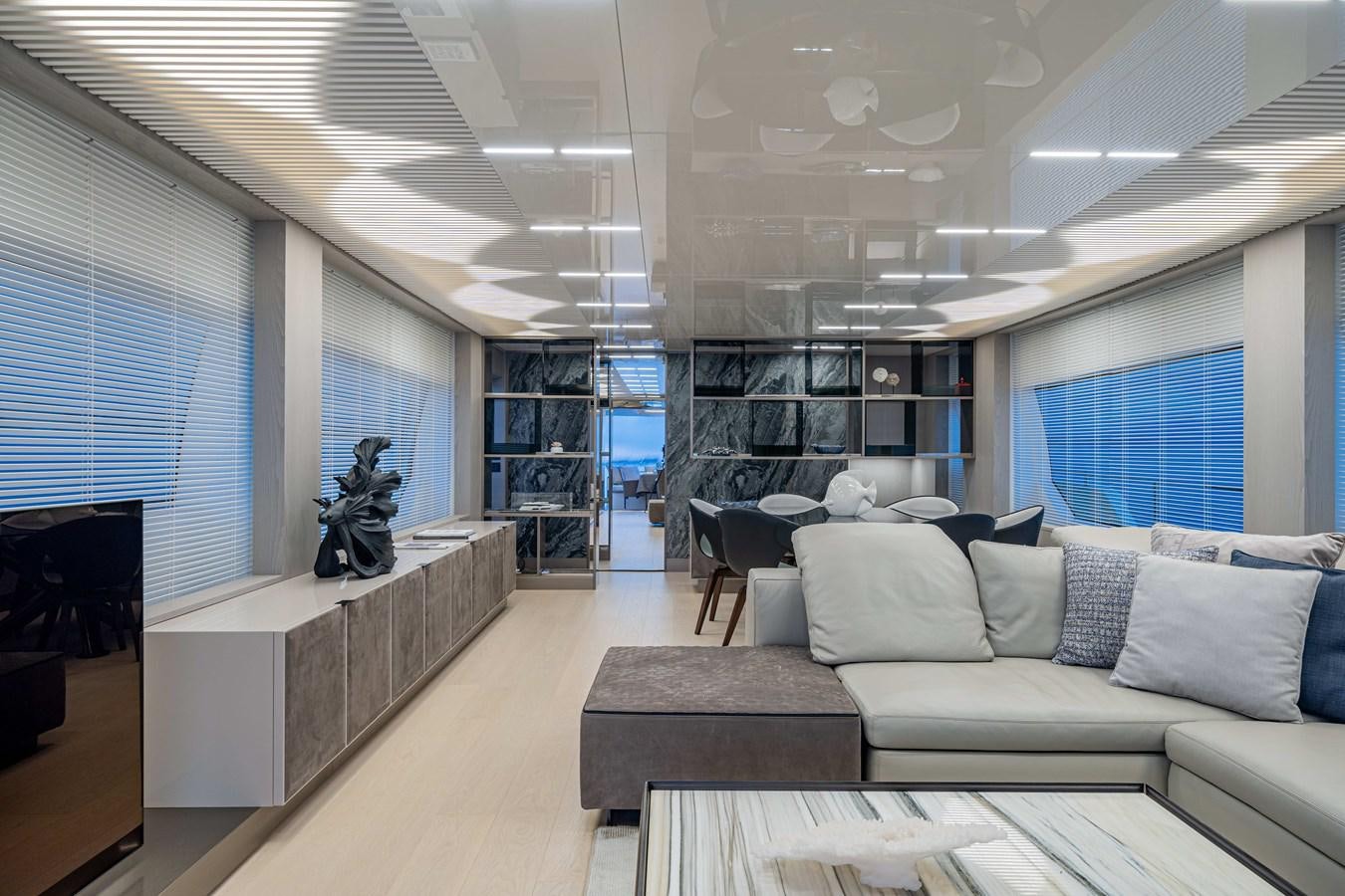 a room with a couch and a tv aboard YEMAJA Yacht for Sale