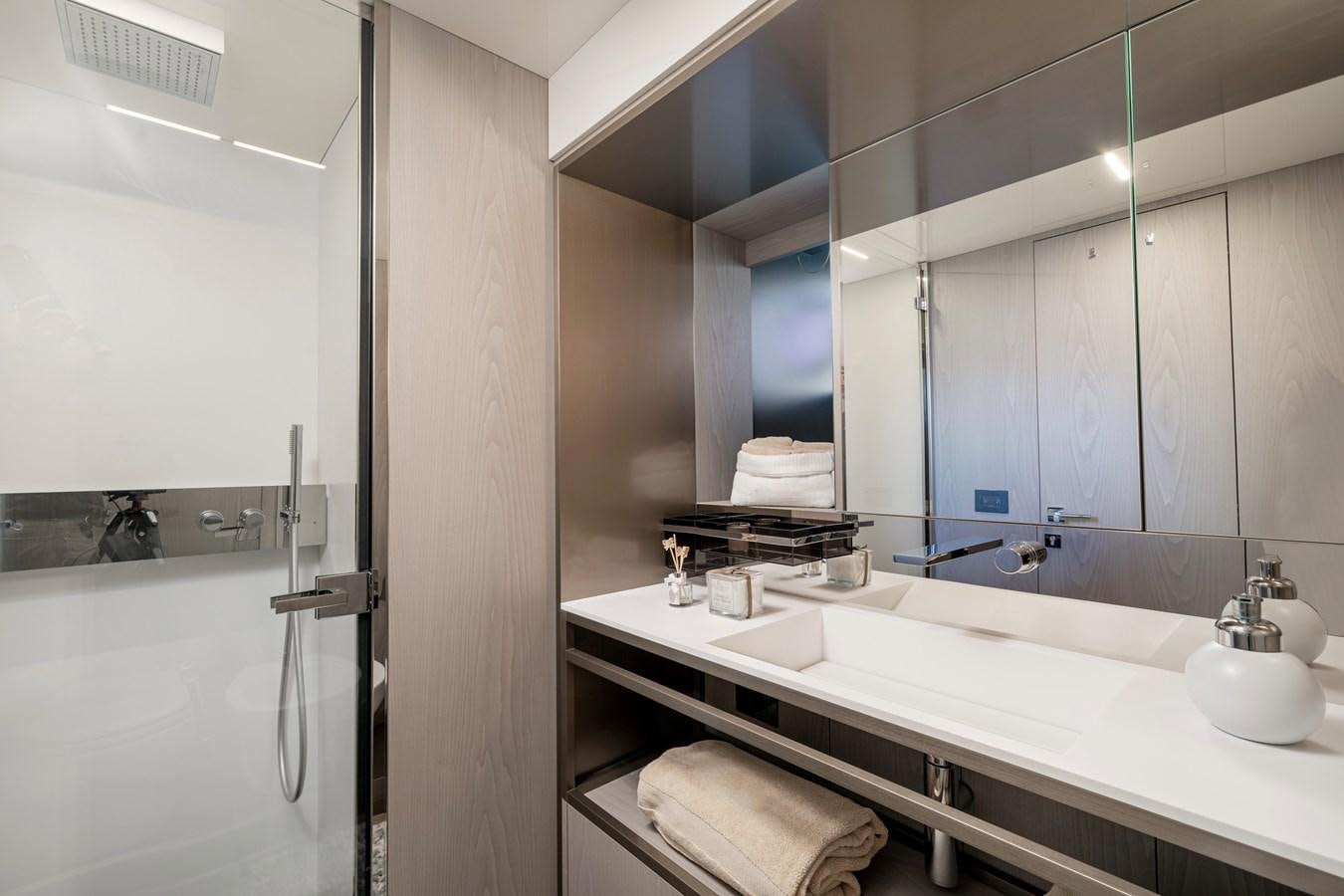 a bathroom with a large mirror aboard YEMAJA Yacht for Sale