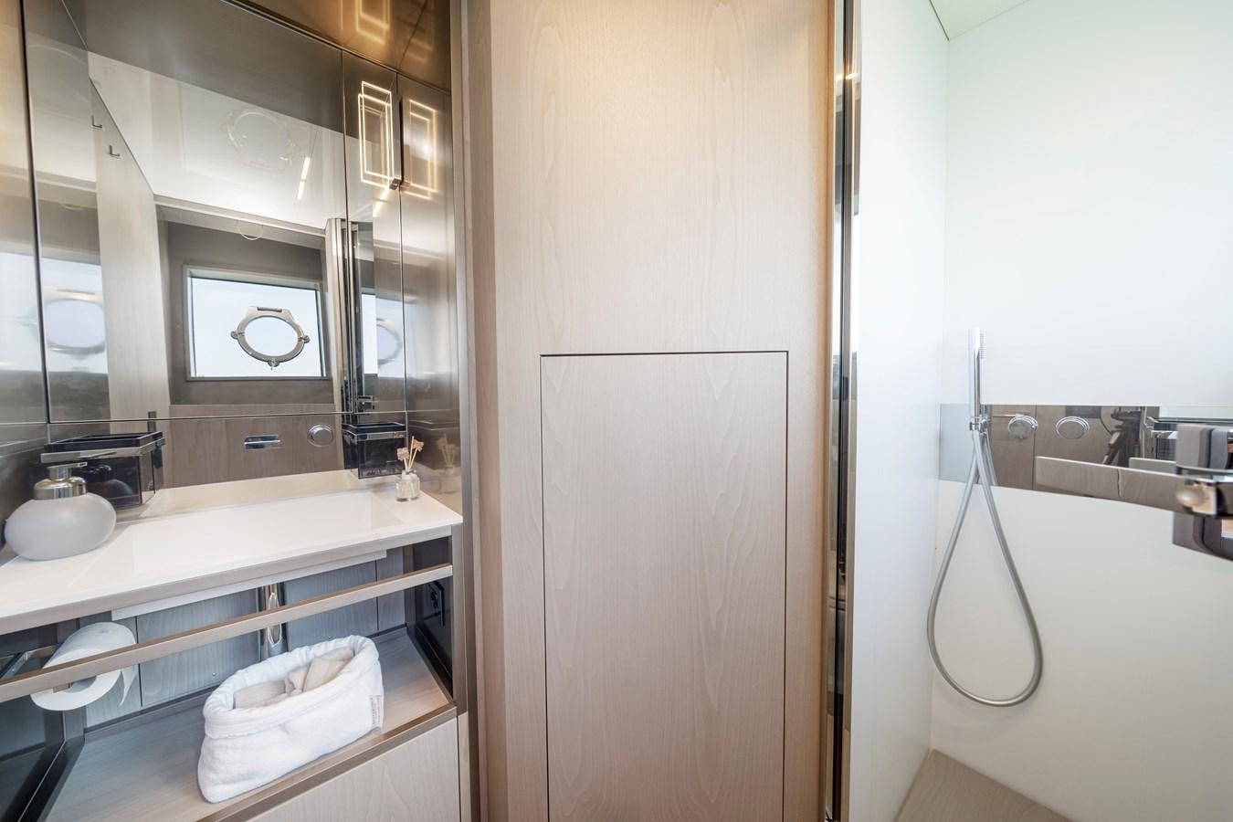 a bathroom with a sink and a shower aboard YEMAJA Yacht for Sale
