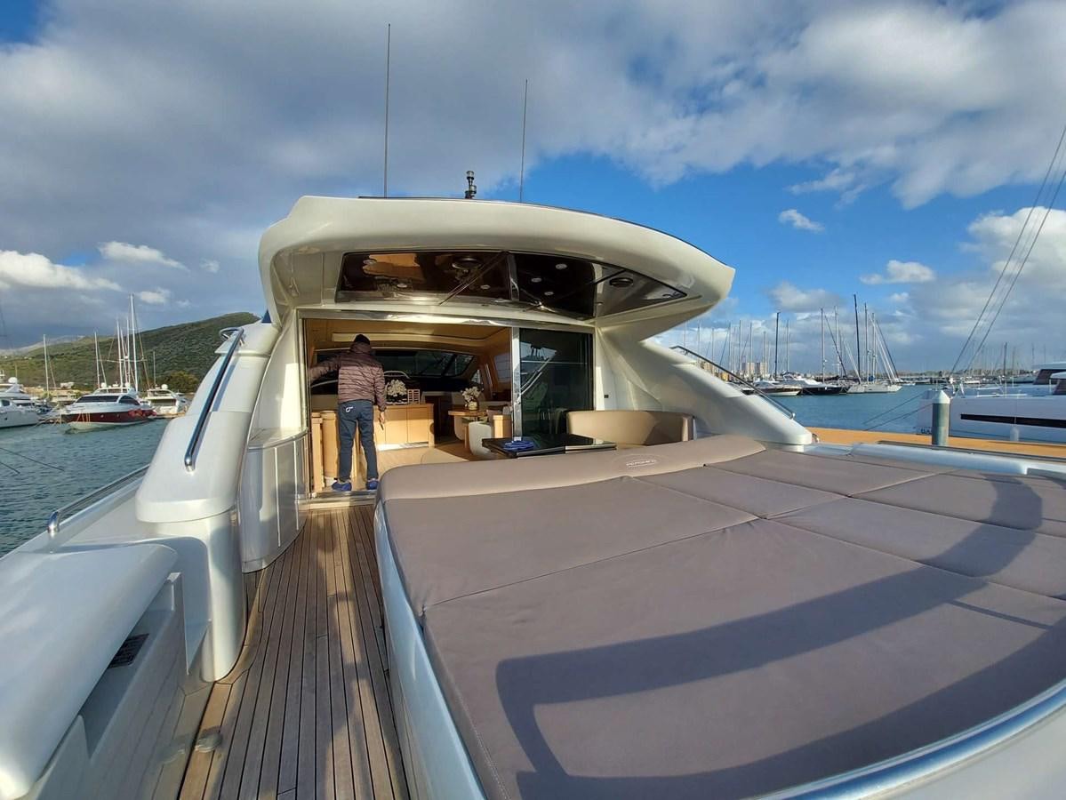 a person standing on a boat aboard ONLY ONE Yacht for Sale