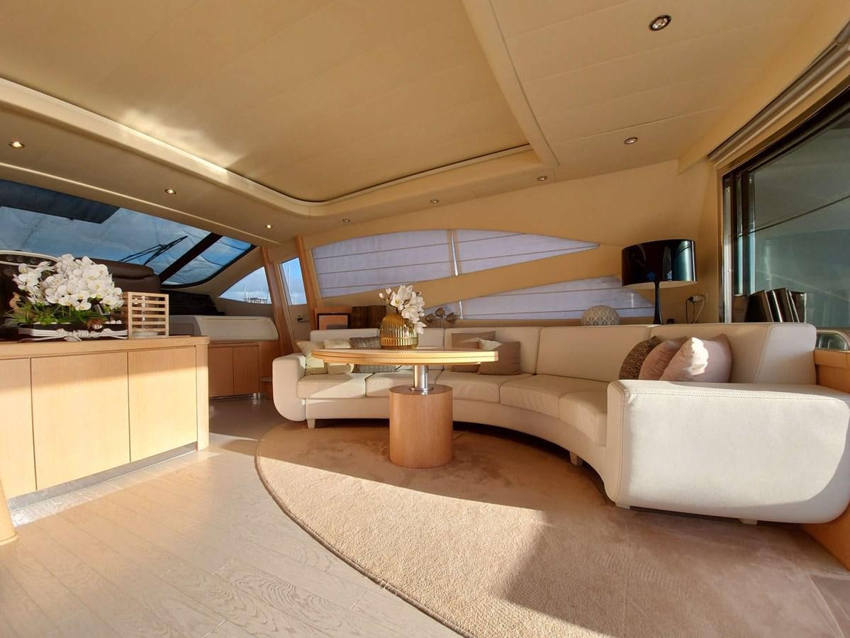a living room with a couch and a table aboard ONLY ONE Yacht for Sale