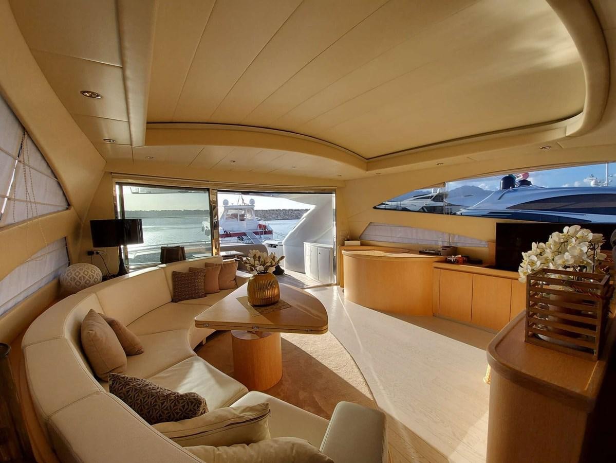 a living room with a large window aboard ONLY ONE Yacht for Sale