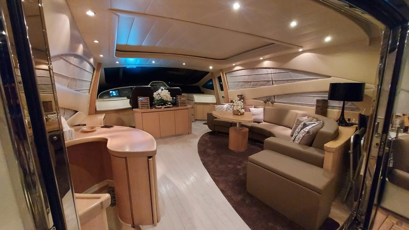 a living room with a couch and a table aboard ONLY ONE Yacht for Sale