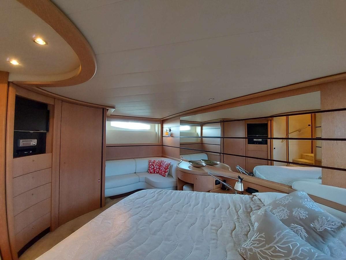 a room with a bed and a television aboard ONLY ONE Yacht for Sale