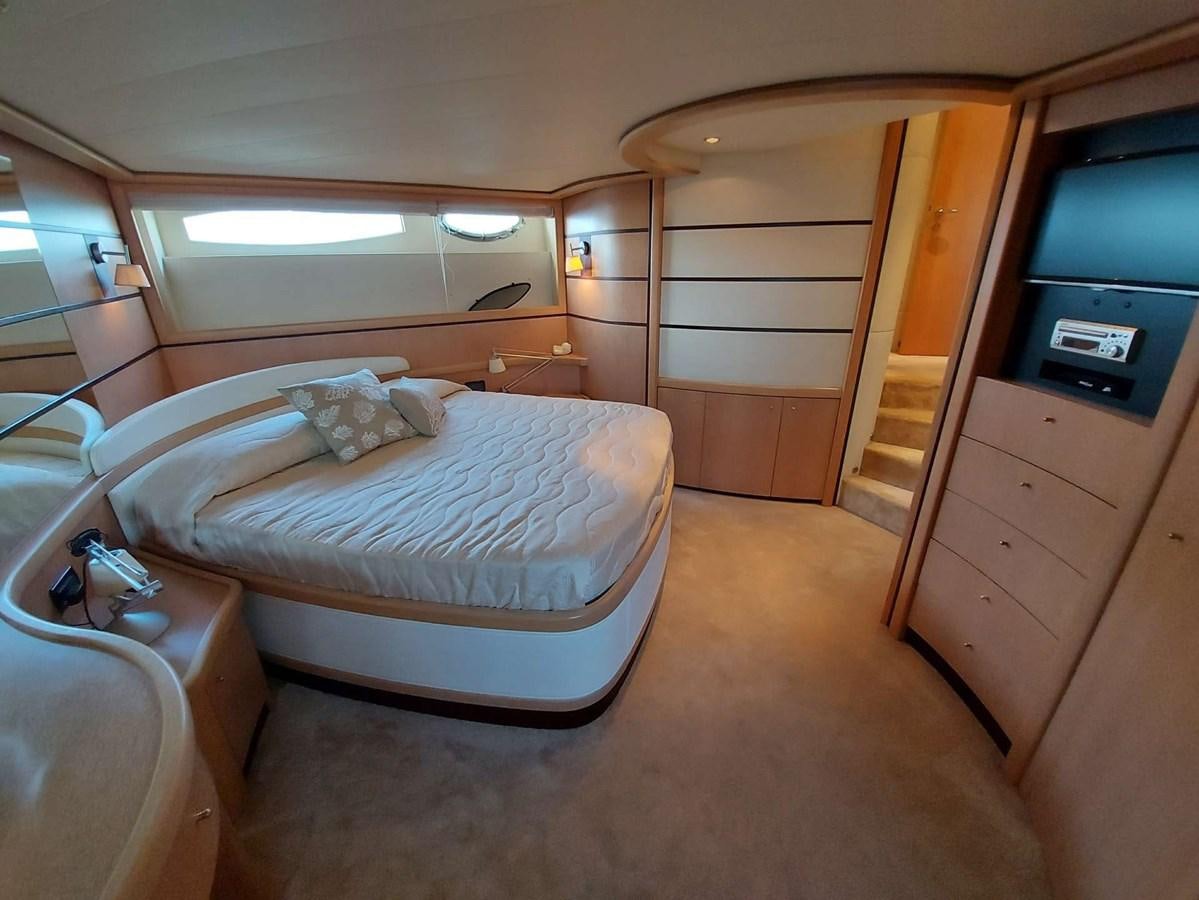 a room with a bed and a tv aboard ONLY ONE Yacht for Sale