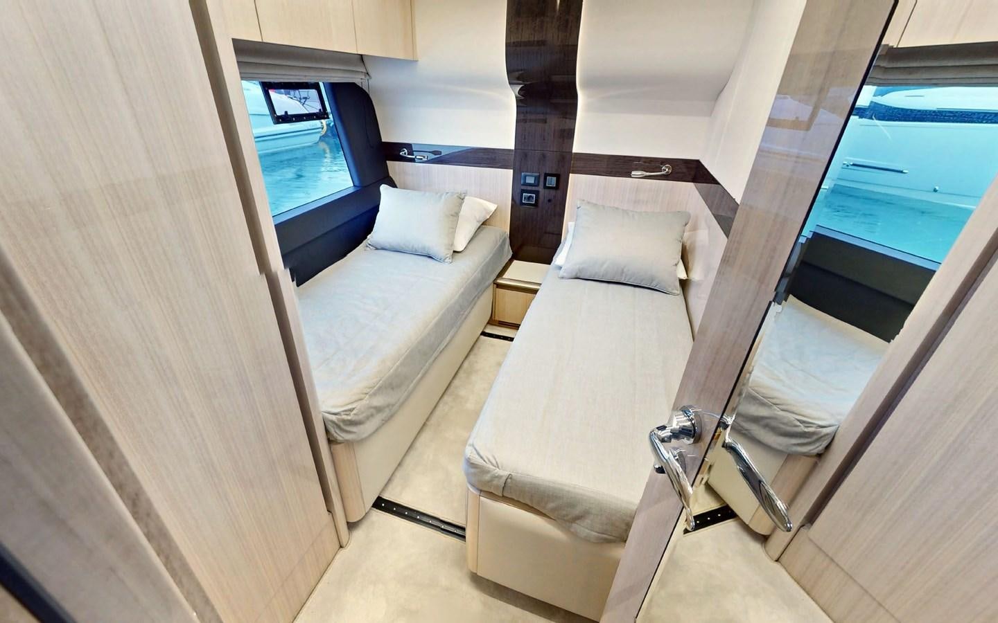 a room with a bed and a television aboard SERENITY Yacht for Sale