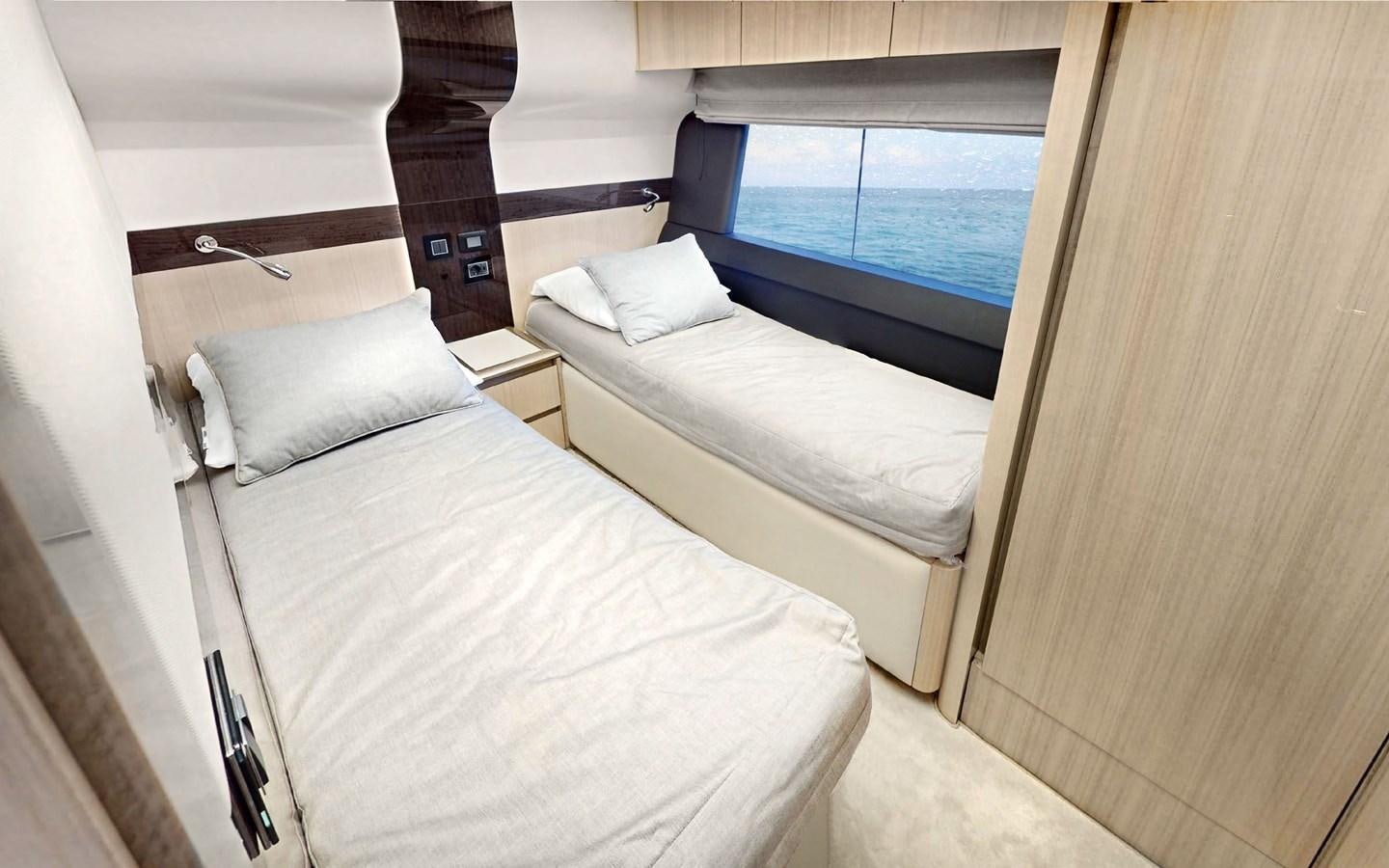 a room with two beds aboard SERENITY Yacht for Sale