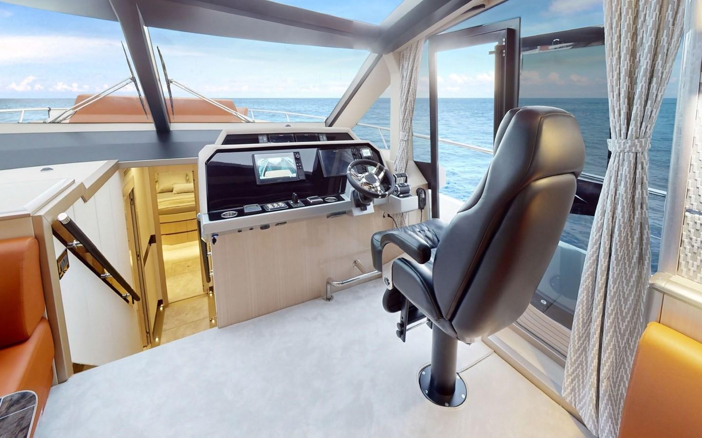 a room with a desk and a chair aboard SERENITY Yacht for Sale