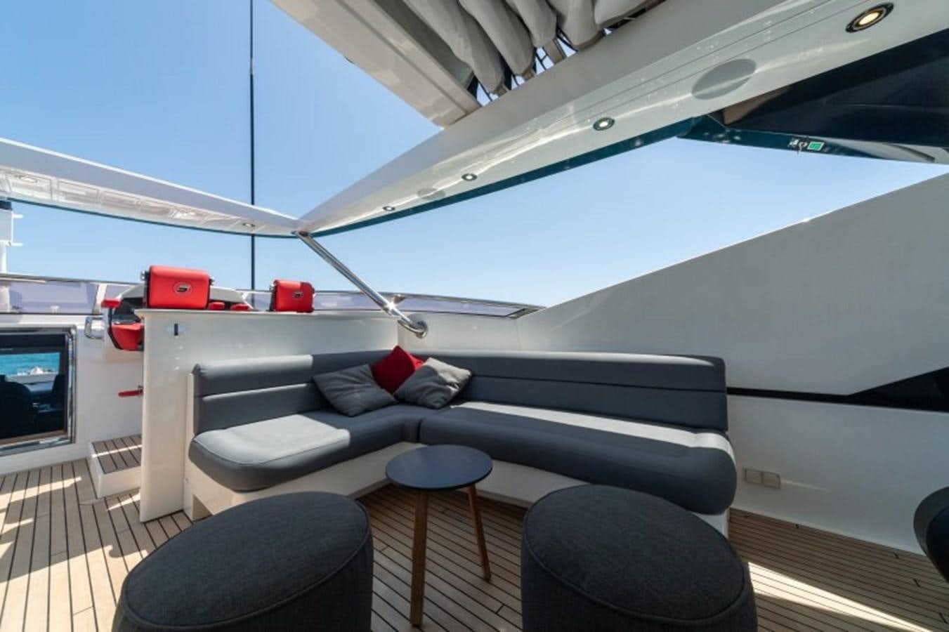 a boat with a couch and a table aboard SURVIVOR 2 Yacht for Sale