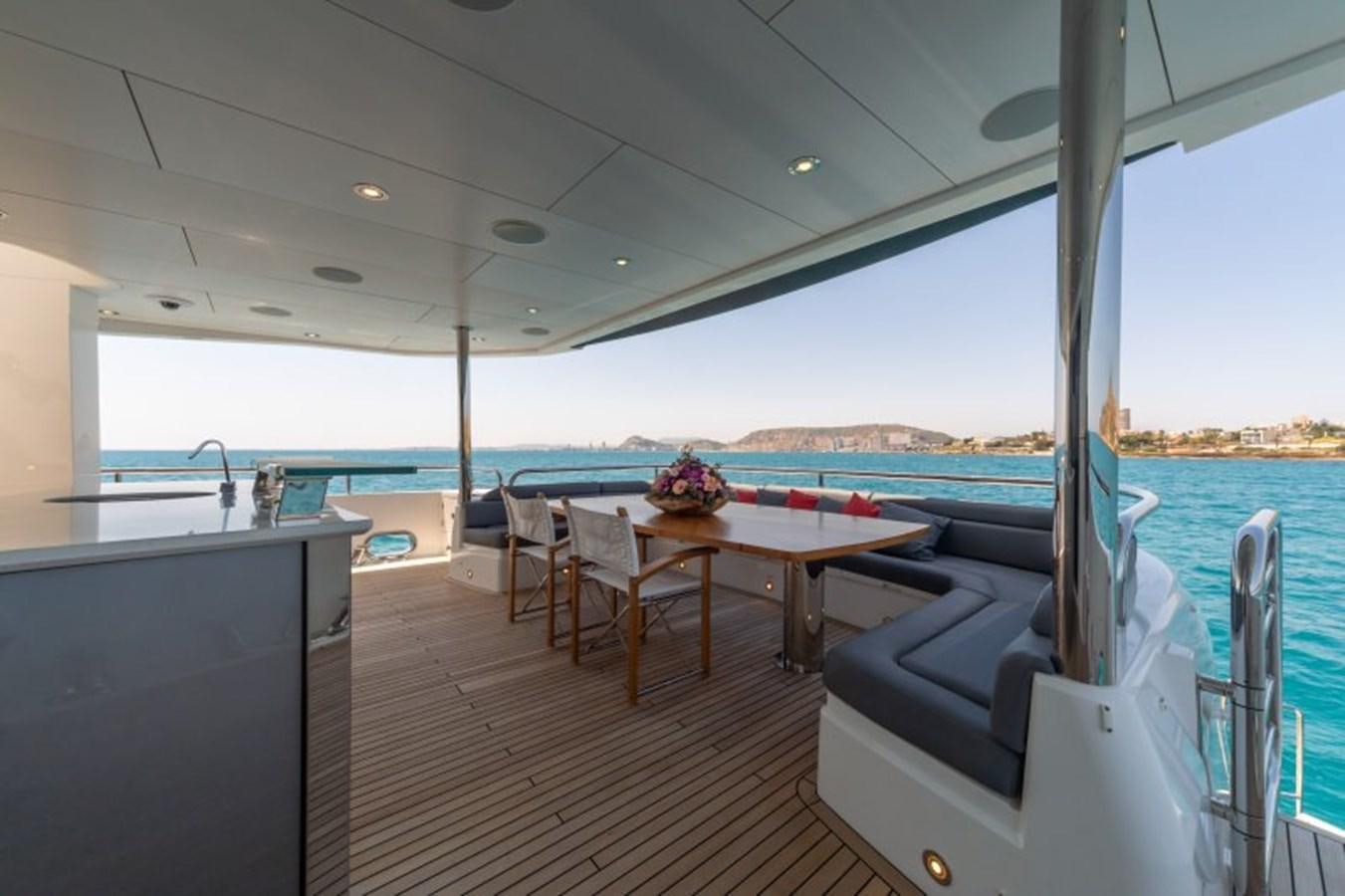 a room with a table and chairs aboard SURVIVOR 2 Yacht for Sale