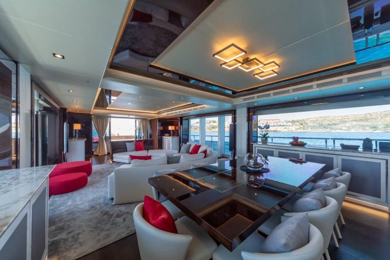 a living room with a large window aboard SURVIVOR 2 Yacht for Sale