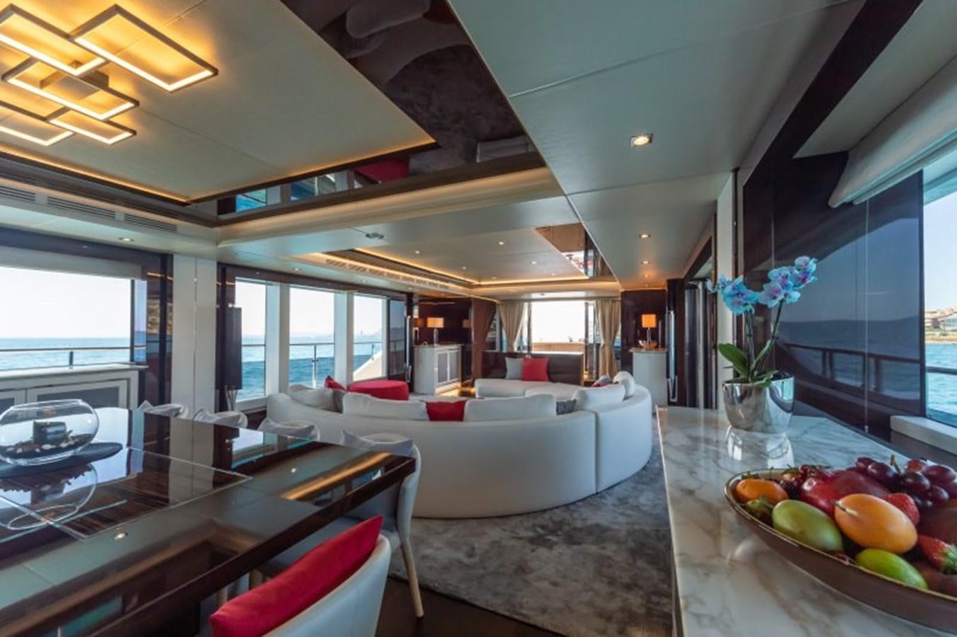 a large room with a table and chairs aboard SURVIVOR 2 Yacht for Sale