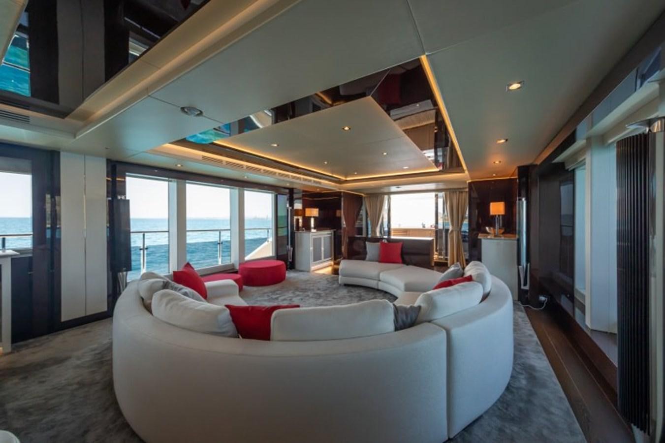 a large room with a bed and a large window aboard SURVIVOR 2 Yacht for Sale