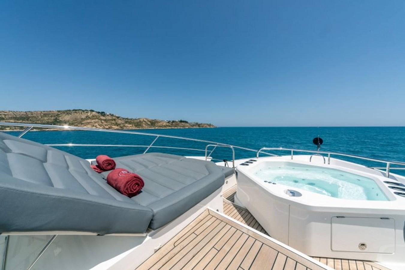 a red hat on a white boat aboard SURVIVOR 2 Yacht for Sale