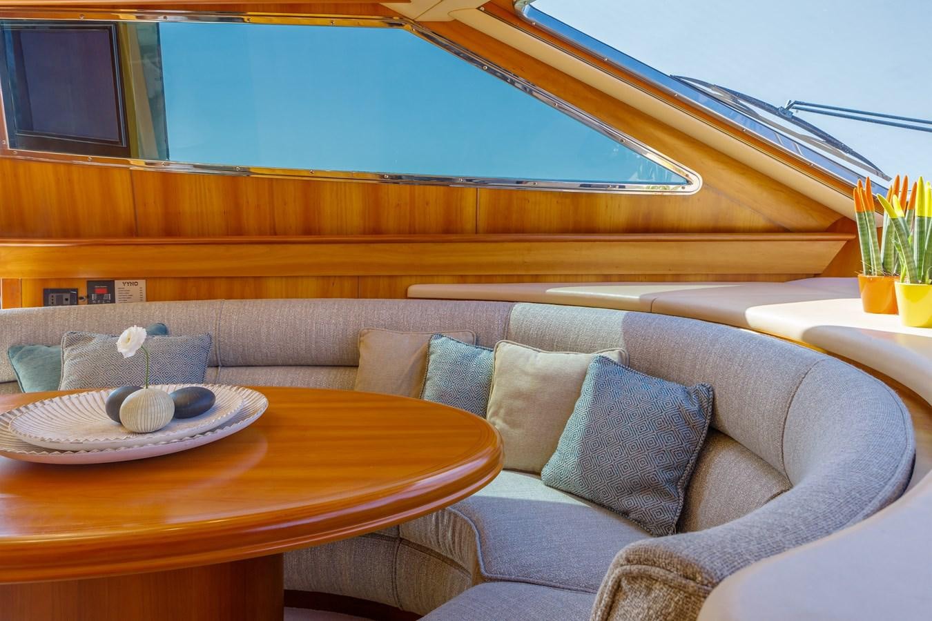 a couch with pillows on it aboard VYNO Yacht for Sale