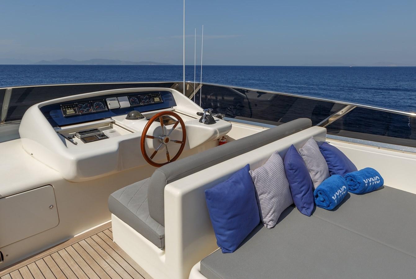 a boat with a seat on the deck aboard VYNO Yacht for Sale