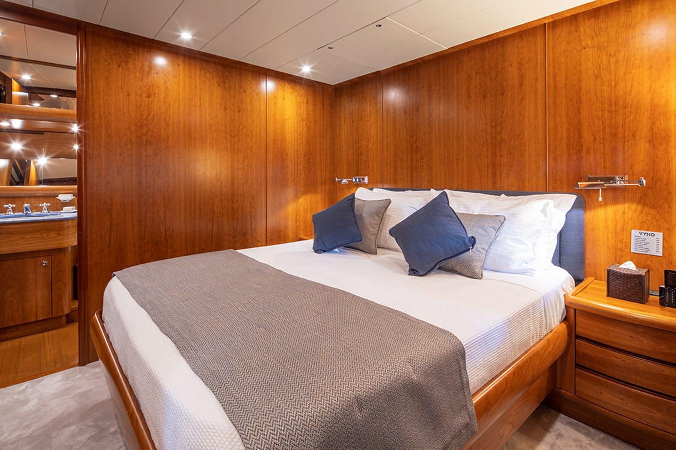 a bed in a wooden room aboard VYNO Yacht for Sale