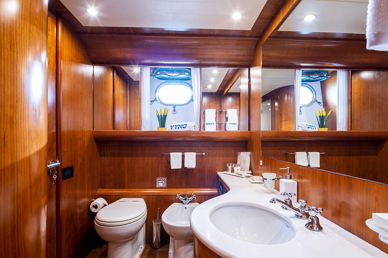 a bathroom with a toilet and a sink aboard VYNO Yacht for Sale