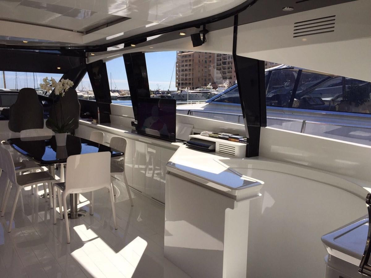 a room with a table and chairs aboard FORZA 8 Yacht for Sale