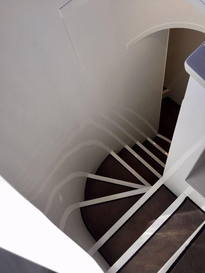 a white staircase with a white railing aboard FORZA 8 Yacht for Sale