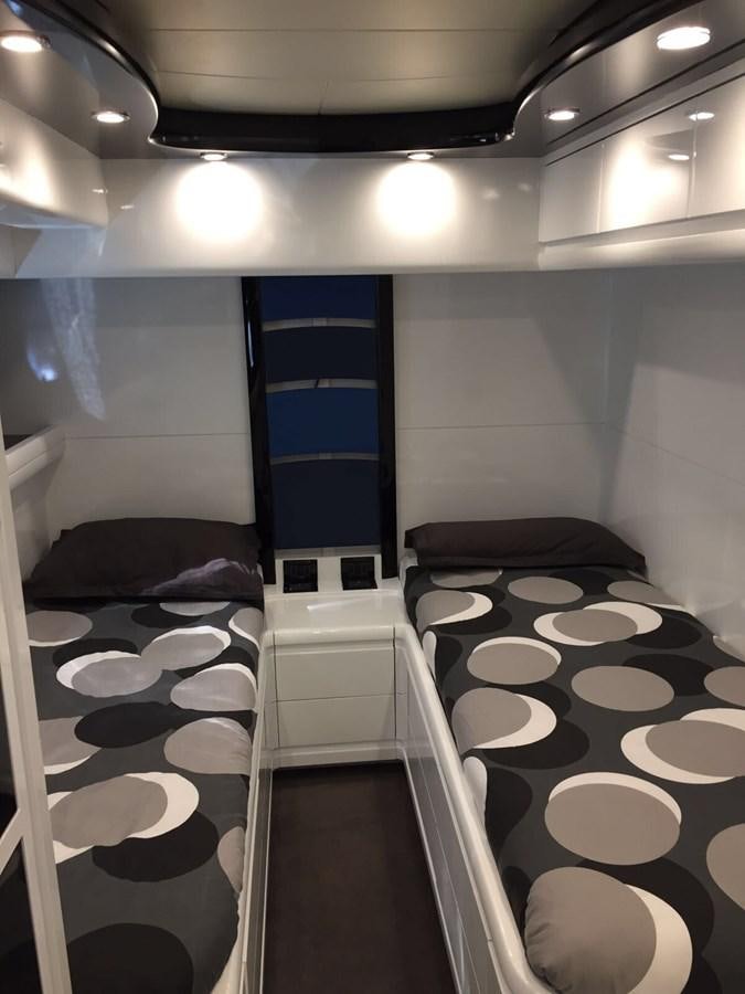 a room with a bed and a blue door aboard FORZA 8 Yacht for Sale