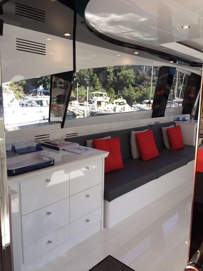 a room with a bed and desk aboard FORZA 8 Yacht for Sale