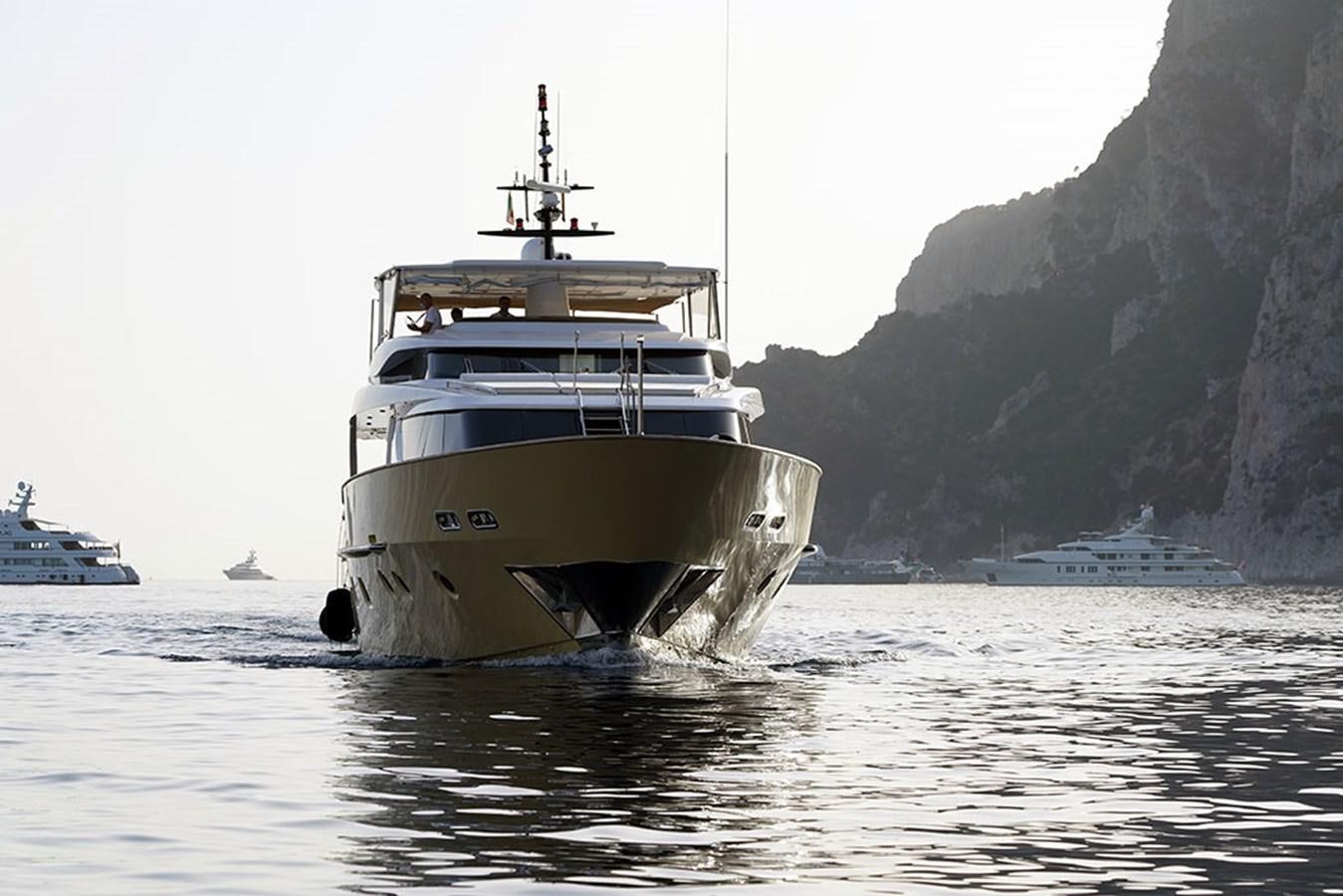 a large ship in the water aboard AKUA Yacht for Sale