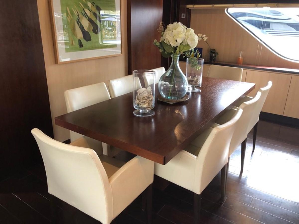 a table with glasses and vases on it aboard AKUA Yacht for Sale
