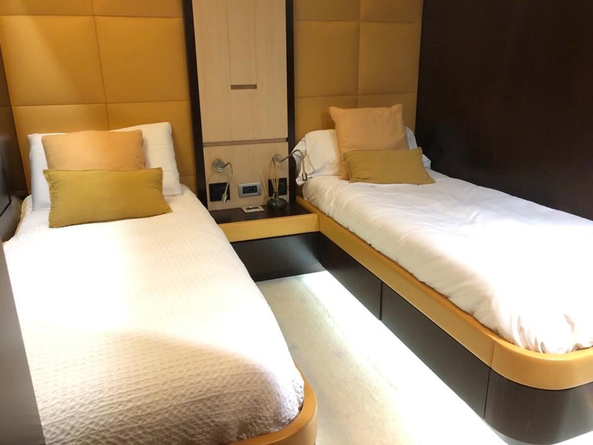 a couple of beds in a hotel room aboard AKUA Yacht for Sale
