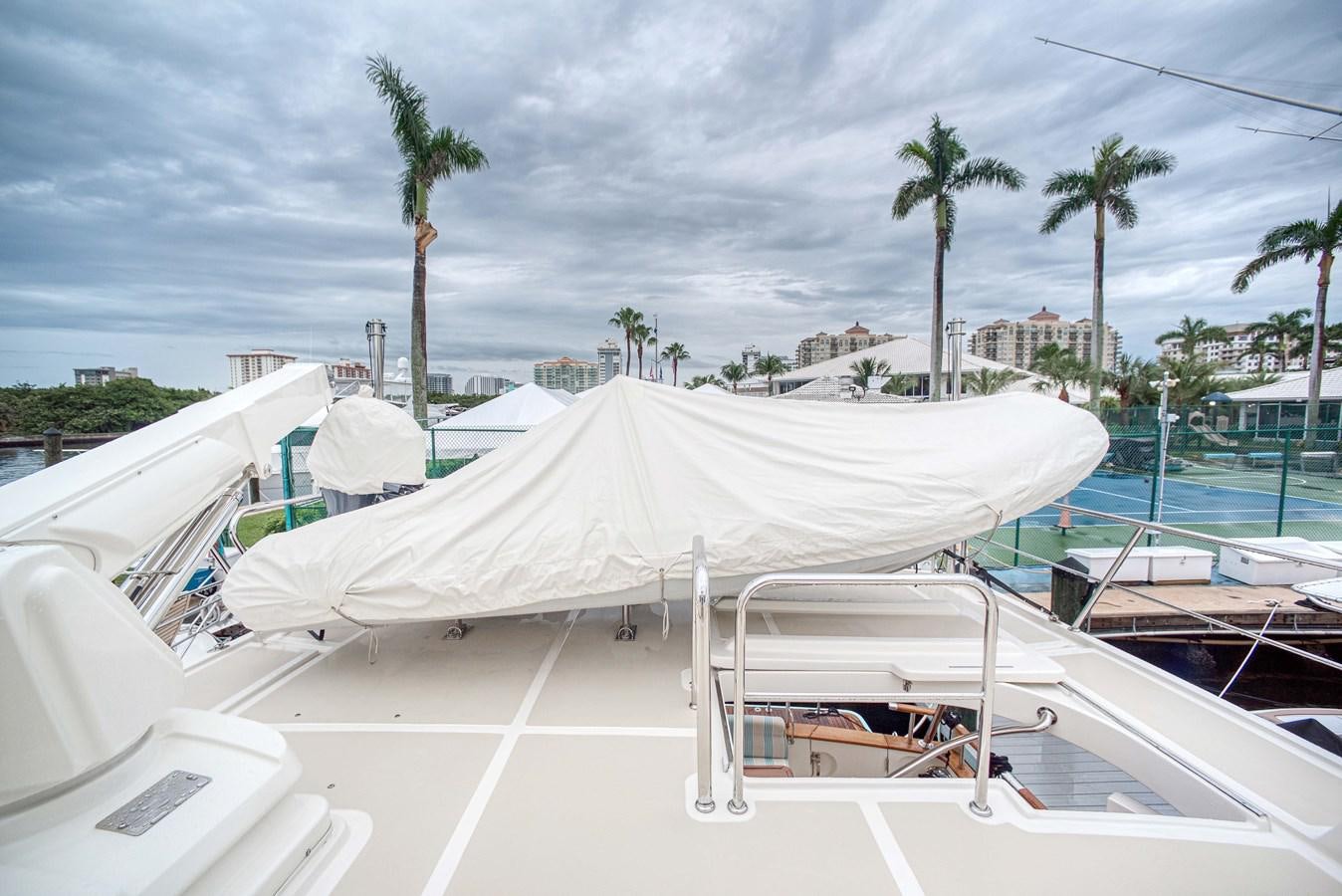 a row of white tents on a beach aboard QUIXOTIC Yacht for Sale