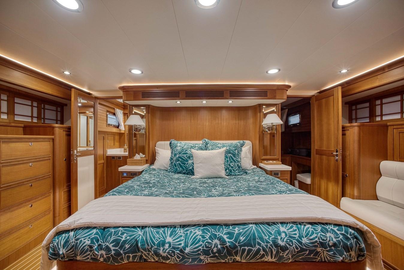 a bed in a hotel room aboard QUIXOTIC Yacht for Sale