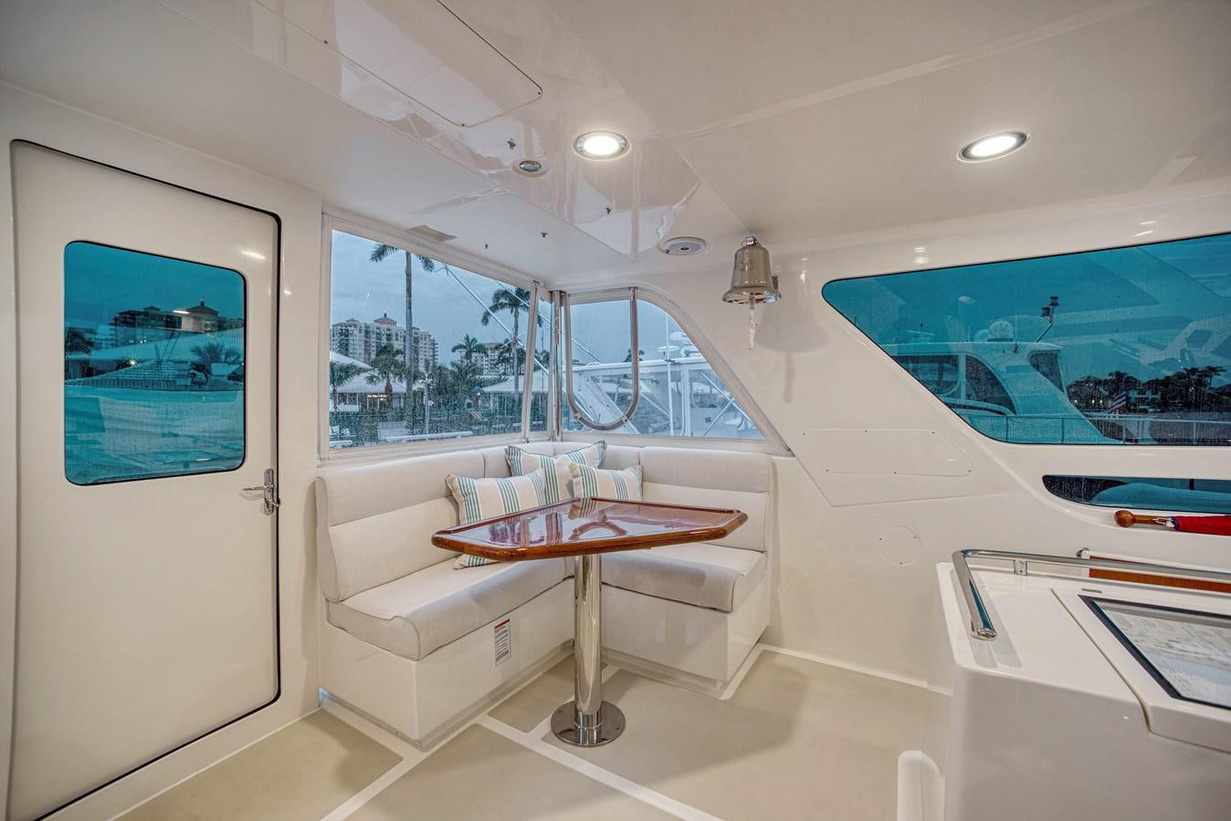 a room with a table and chairs aboard QUIXOTIC Yacht for Sale