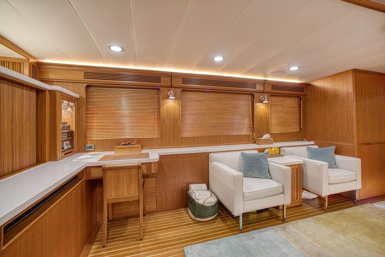 a room with a couch and a table aboard QUIXOTIC Yacht for Sale