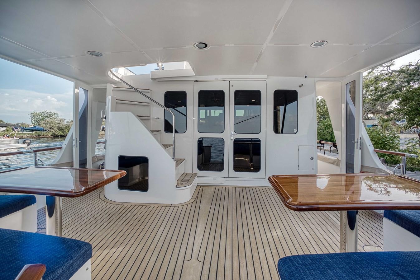 a room with a table and chairs aboard MAGIC Yacht for Sale