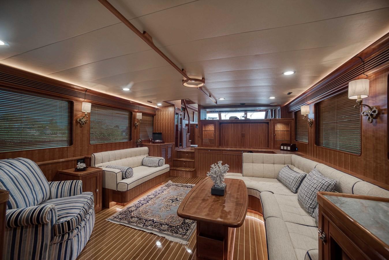 a living room with a couch and a table aboard MAGIC Yacht for Sale